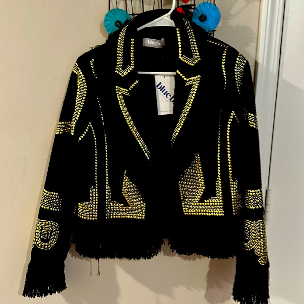 Women’s black jacket with gold studs and fringe